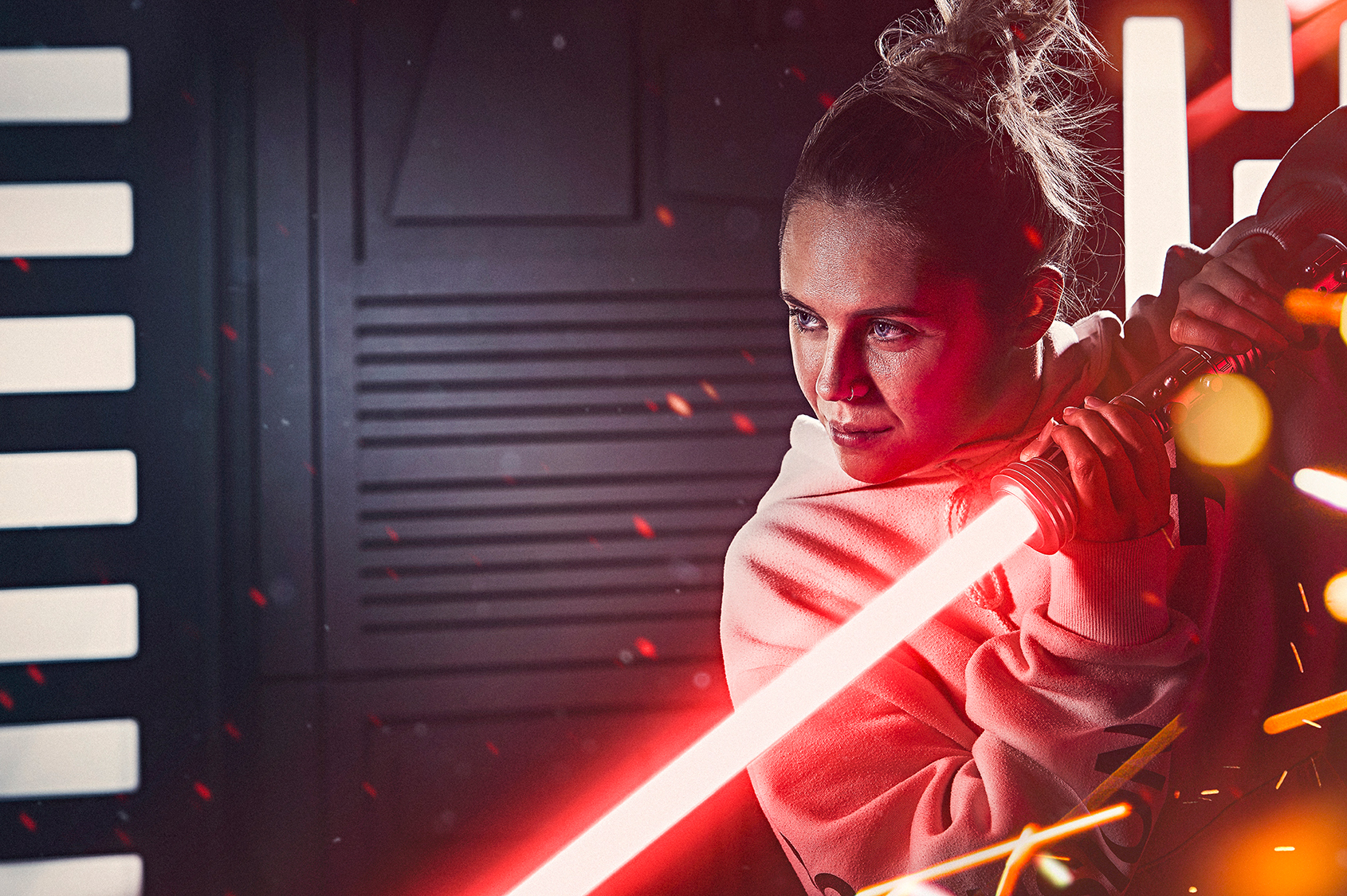 Woman holding red lightsabre